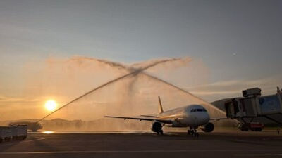 The flight arrived at Chiang Mai International Airport and was welcomed with a traditional water cannon salute