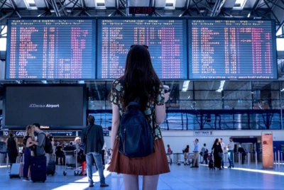 a woman looking at a screen with a number of information